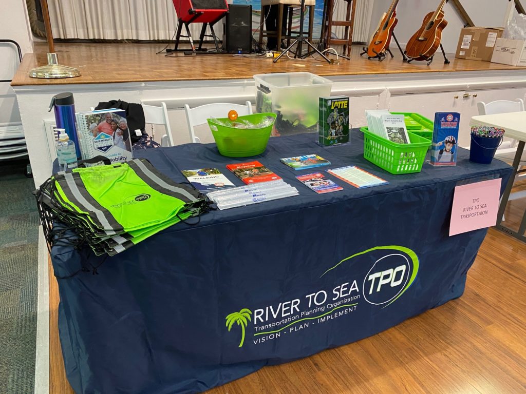 The River to Sea TPO Display Table with a spin wheel for prizes