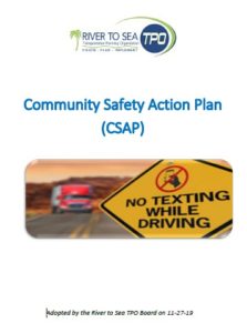 Cover of the Community Safety Action Plan Document with a picture of a yellow caution sign that states No texting while driving 