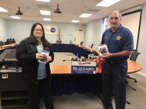 Sheriff Chitwood and Pamela Blankenship holding bicycle lights